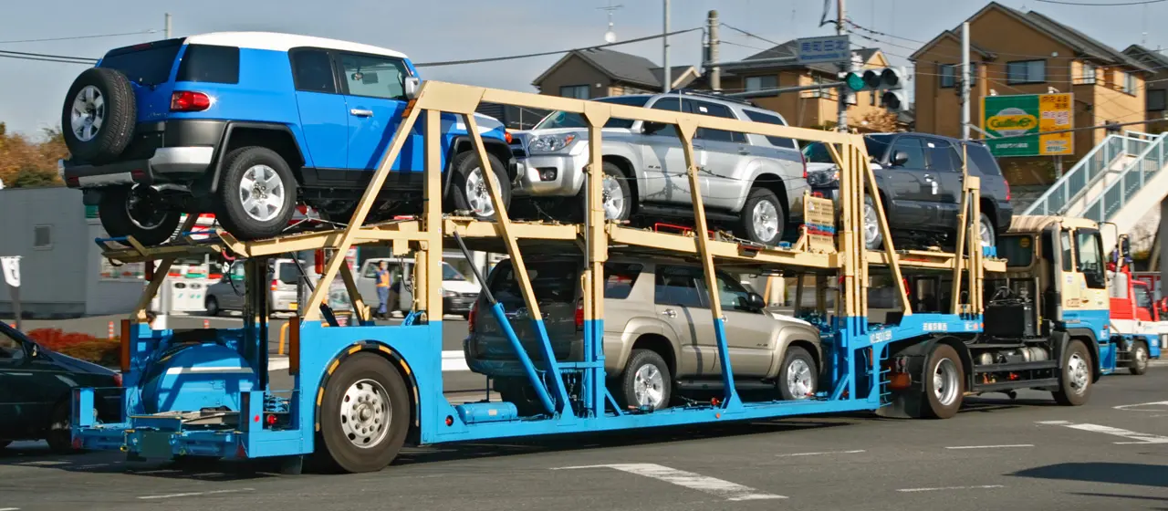 on trailer truck carrying cars for shippment