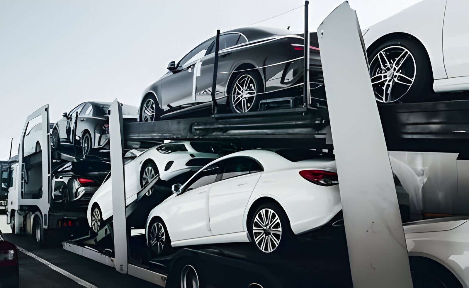 Car carrier truck loaded with cars: breamway auto transport 